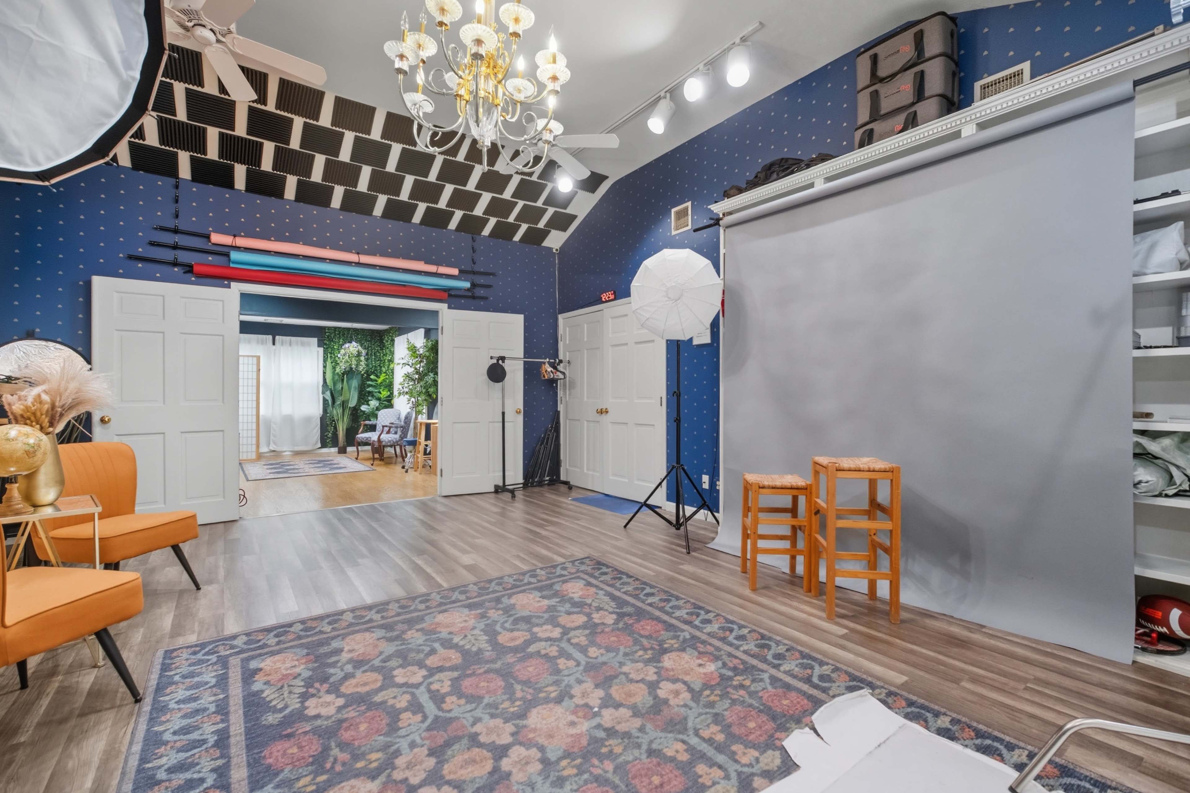 Photography set with studio lighting and orange chairs